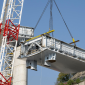 Another bridge deck section is carefully lifted into place (photo courtesy Salini Impregilo/PerGenova)