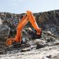 An Hitachi ZX690-7 crawler excavator at work in a quarry