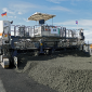 At Keflavik Air Base, the Wirtgen SP 62i delivered precise single-layer concrete paving with a width of 7.62m and a thickness of 41-45cm