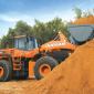 Doosan loader hauling sand