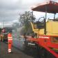 Paver working on road