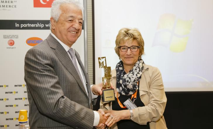 Turkish Ambassador Hakki Akil accepted a thank-you trophy from Maryvonne Lanoe, INTERMAT show director Turkish Ambassador Hakki Akil and Maryvonne Lanoe