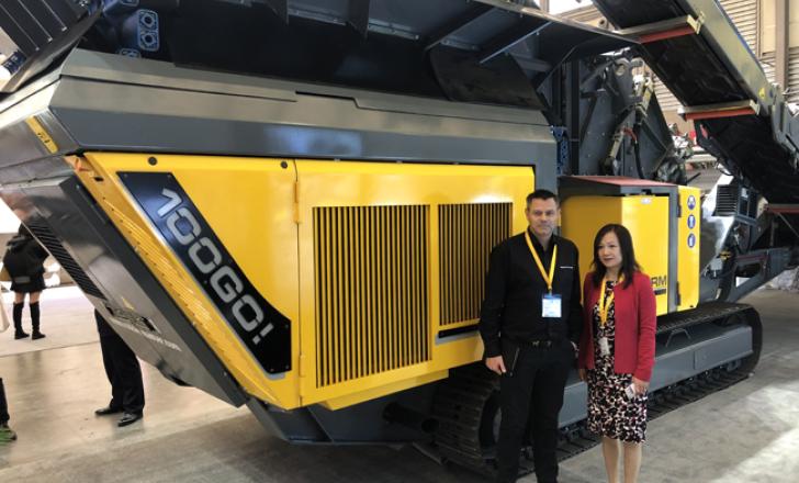 Shaun Montgomery and Sheng Shi in front of the at-show RM 100GO! compact crusher IMG_2632 rubble.jpg