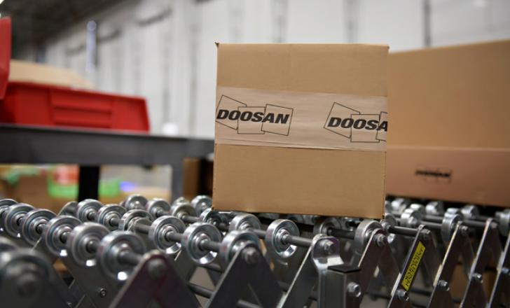 Doosan Infracore now has a new parts facility in the US Doosan_USA_PDC_opening_pic2_red.jpg