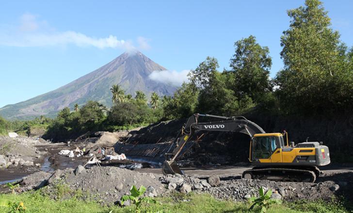 One of four EC210D units from Volvo Construction Equipment are delivering much needed protection to Filipino villagers living near the Mayon volcano PIC 1.jpg