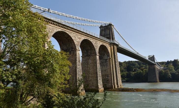 The Grade I listed structure crosses the Menai Strait between the Welsh island of Anglesey and mainland north Wales (image © Peewam/Dreamstime)