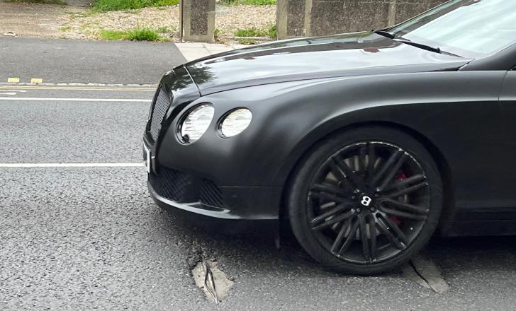 The UK has a serious pothole problem that causes traffic delays and vehicle damage - image © courtesy of Mike Woof