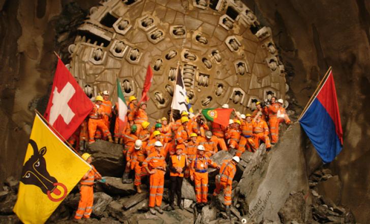 The Swiss want to reduce the number of road freight vehicles travelling through the Alps after the Gotthard Base Tunnel opens in 2019. Seen late last year is the breakthrough in the eastern tube of the twin tube 57km long tunnel.
(Pic: Herrenknecht) drilling a tunnel under the Alps in Switzerland