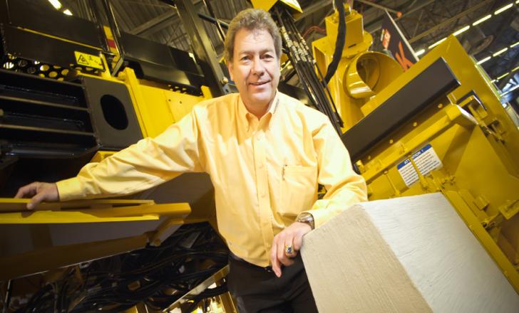Gomaco Europe, Middle East, Africa and CIS managing director Rory Keogh with the firm’s new 4400 slipform paver Gomaco 4400 slipform