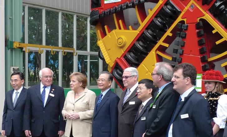 Seen in front of the Herrenknecht EPB Shield being used for the Metro in Dongguan are visitors to the company's plant including (second from left) Dr Martin Herrenknecht; Dr Angela Merkel (third from left) and Wen Jiabao (fourth from left) Angela Merkel at Herrenknecht plant in China