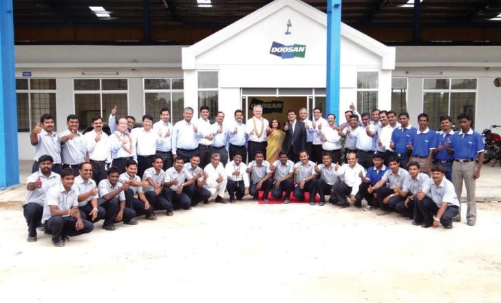 Staff outside the new Doosan facility in India Staff outside the new Doosan facility in India