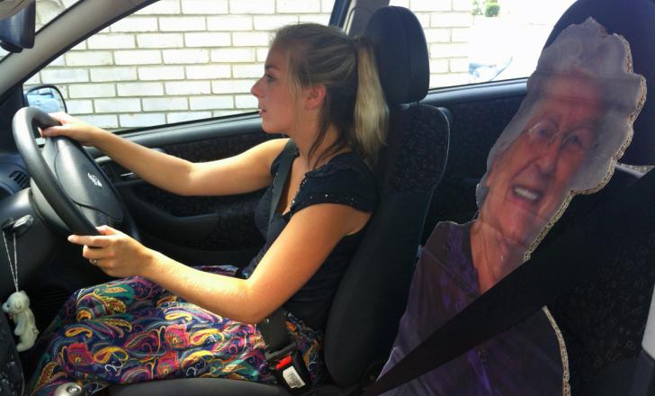 Student Mollie Courtenay driving a life-size cut-out of her gran, Janet Allum Student Mollie Courtenay driving a car